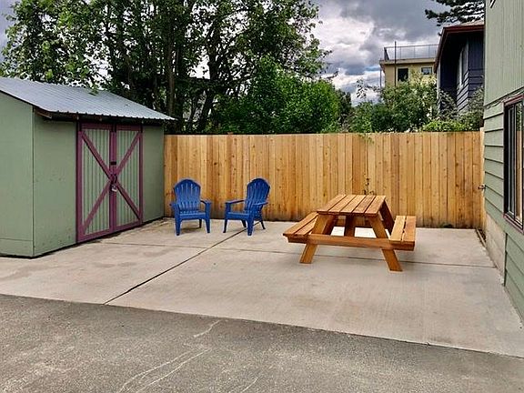 Large, sunny patio can accommodate parking car and lounging/entertaining.