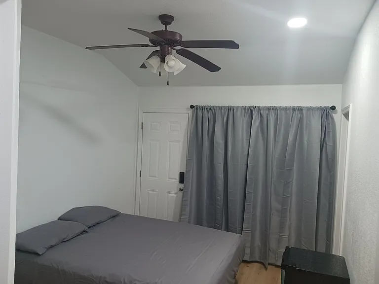 Queen bedroom with private bath, and private entrance to patio with paved walk to front--all new construction.