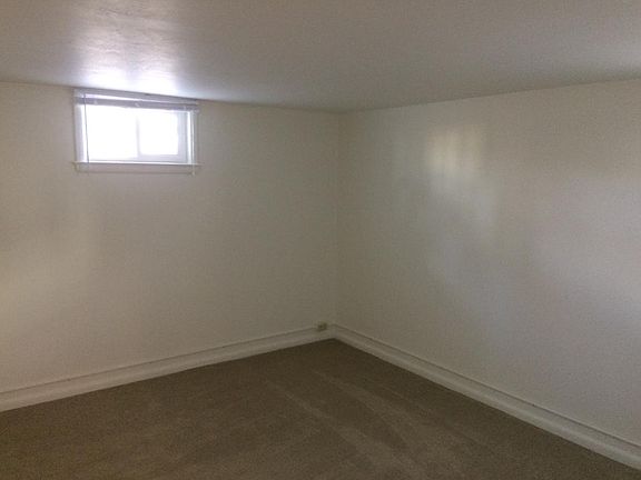 Bedroom in basement, windows are not egressable.