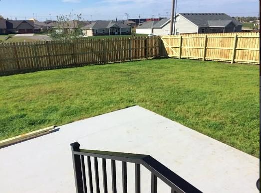 Fenced Yard with large patio