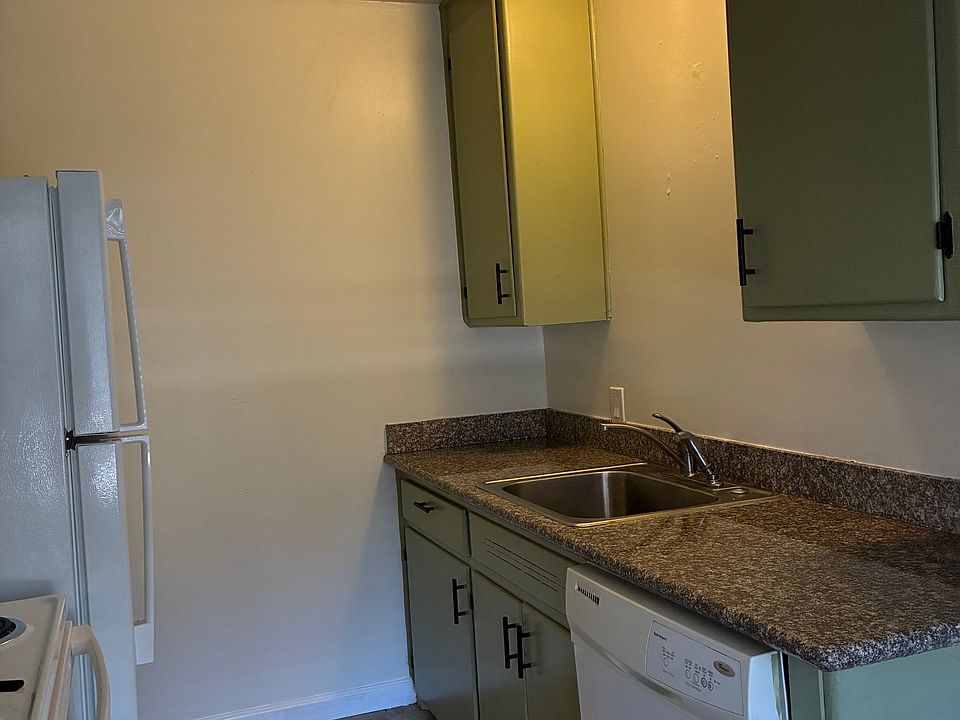 Kitchen with new refrigerator and stove.