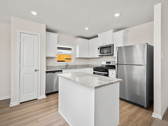 This home includes a chef-ready kitchen with granite counters, stainless appliances!