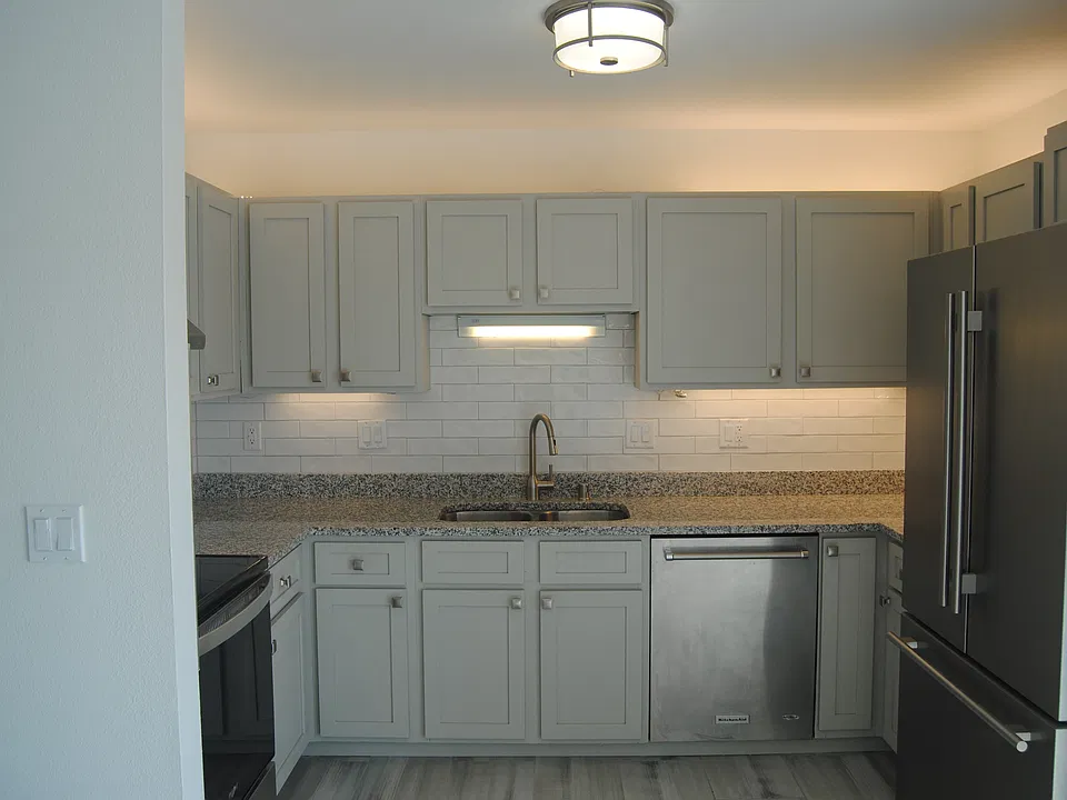 Welcome to 701 Princeton Court #705! This upper apartment has a beautiful, bright kitchen with new cabinet lighting and tiled backsplash.
