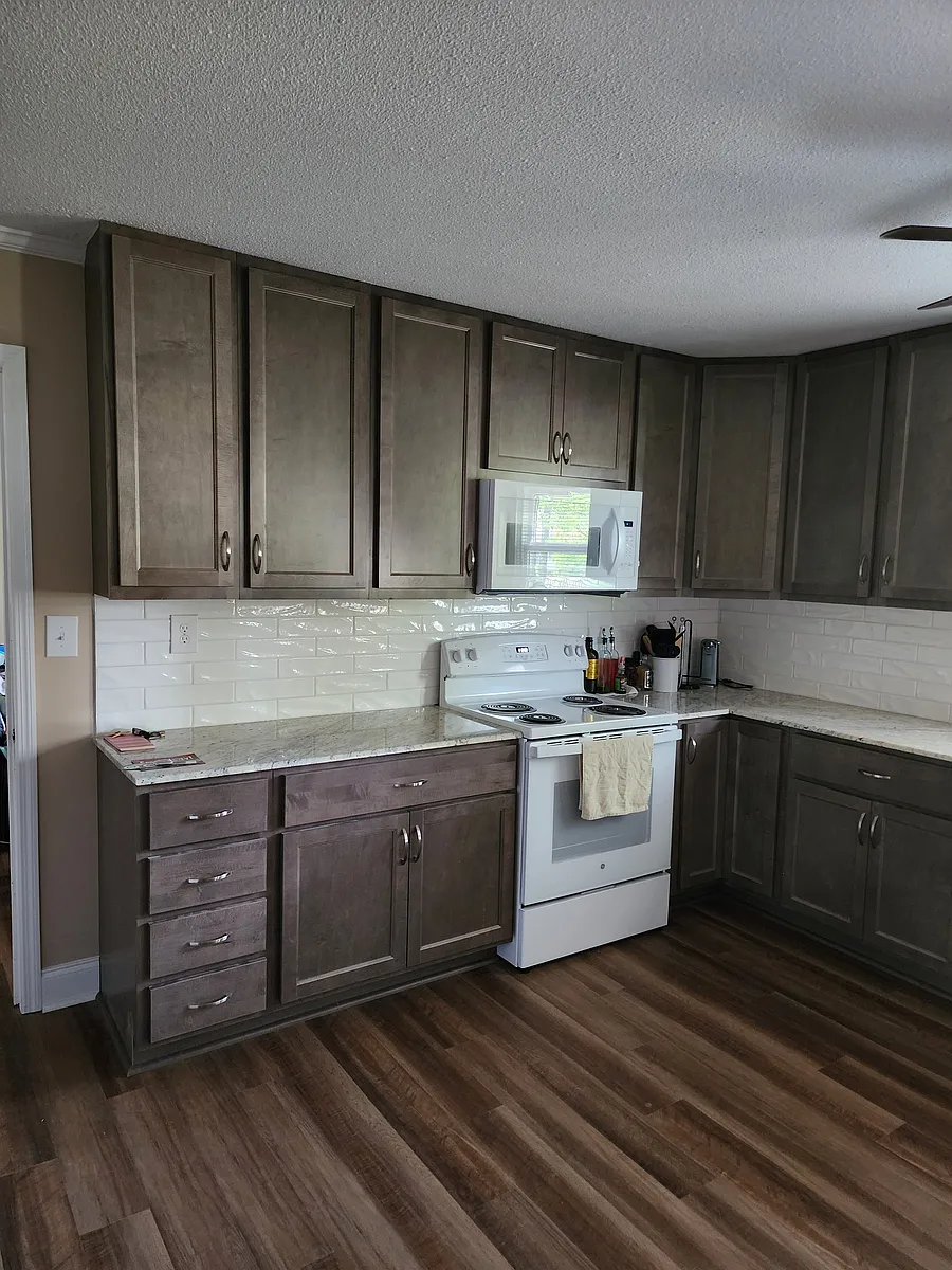 Kitchen stove and microwave. Misc on counter not included. - 451 Hallmark Rd
