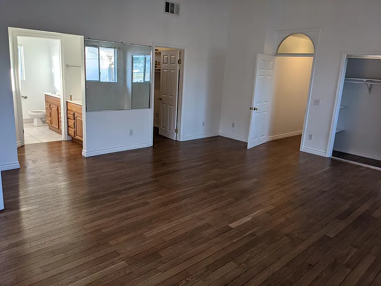 Master bedroom. 2 closets (1 mirrored) and 1 walk in. Ceiling fan.