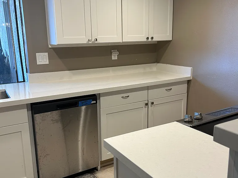 New kitchen including quartz counter tops