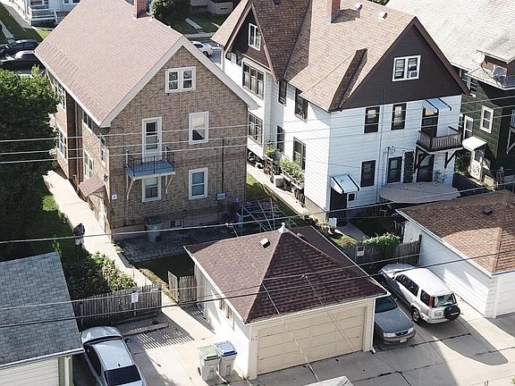 Rear aerial, showcasing parking availability and back balcony.