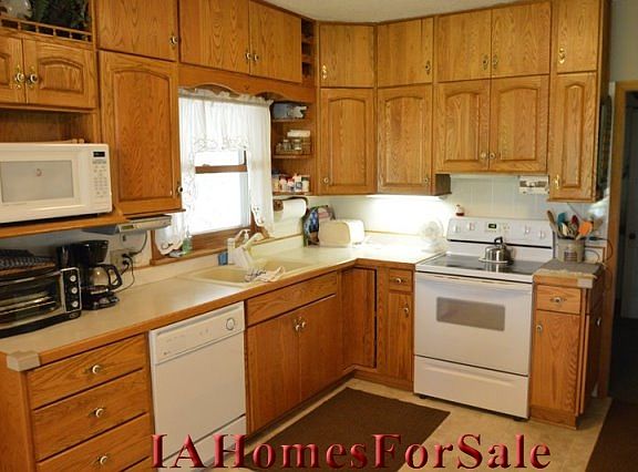 Kitchen was updated with all new solid Oak Cupboards in 1994.  Appliances (Stove, Microwave, Dishwasher, Refrigerator, Washer and Dryer) stay for the new owner.