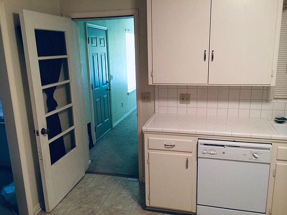 Kitchen includes dishwasher. Opens to third bedroom/study/media room.