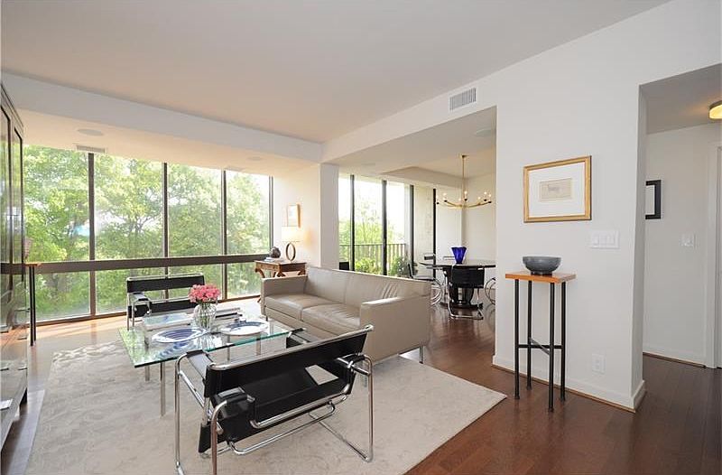 The light-filled main living area, open to the adjacent dining room and the kitchen, off camera to t