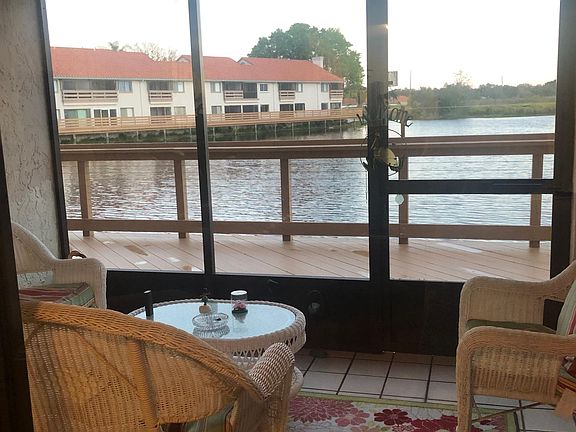 Screened porch overlooks water