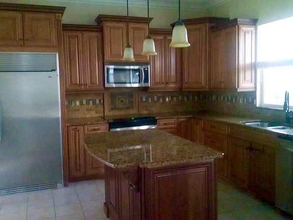 Custom gourmet kitchen with 60 inch refrigerator freezer