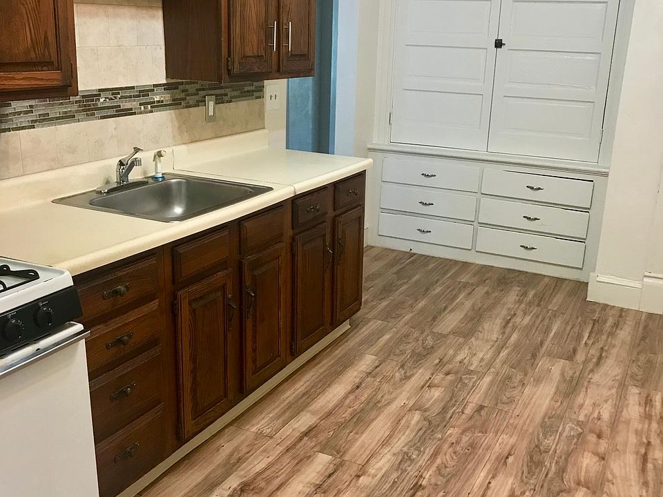 Reverse angle kitchen with built-in cabinets