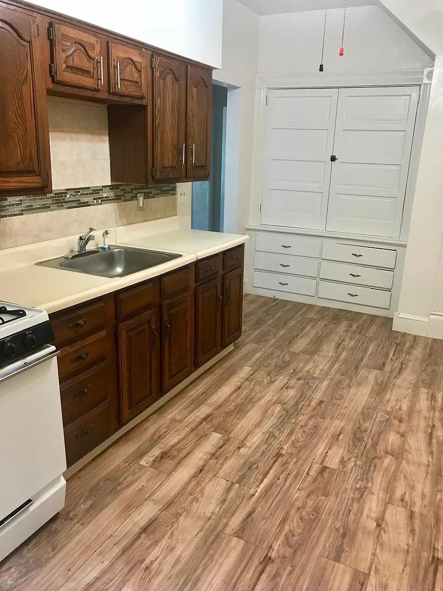 Reverse angle kitchen with built-in cabinets - 674 Middle Ave
