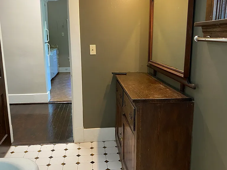 bathroom storage unit with mirror is included