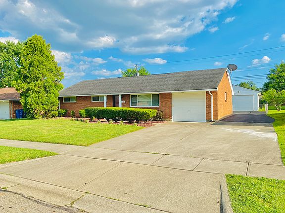 Side view showing driveway to the 2 car detached garage