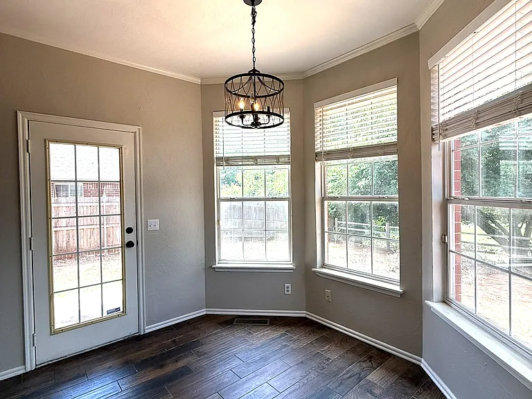 Different angle of the breakfast nook with back door accessibility.