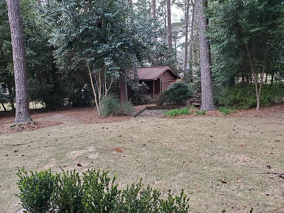 Backyard with Workshop, storage shed, and patio area.