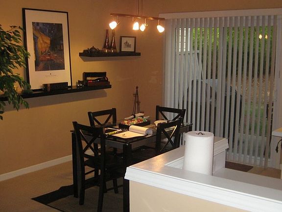 Separate dining area with ambient track lighting