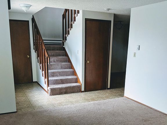 Entrance/coat closet and large under stair storage