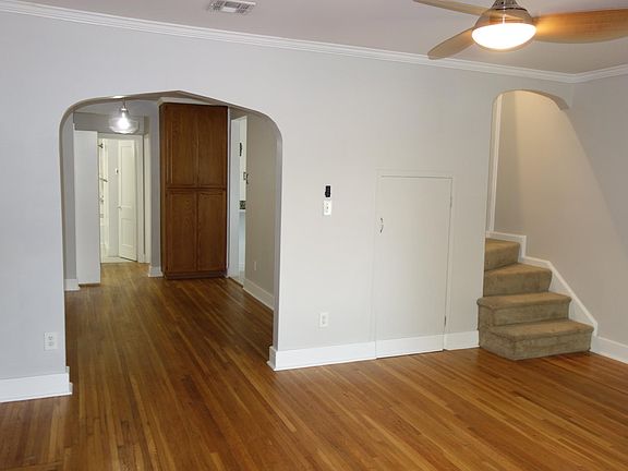 Living Room with Dining Room on the left and Stairs to second floor on the right. Wonderful hardwood throughout!!!