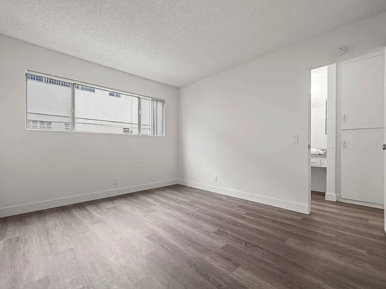 Bright bedroom with custom hard surface flooring