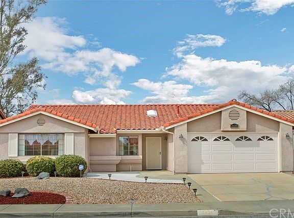 Home with a Warm Heart!  Lovely, Single Story home situated on the Fairways of the Seven Hills Golf Club.