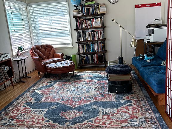 Large, living room has lots of light. New double-hung windows for ocean breeze and easy cleaning. Some use entry area to left as an office space.