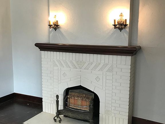 Beautiful original faux fireplace, lights and insert
