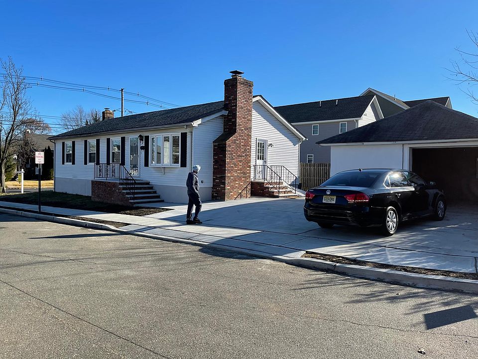 Corner lot fully renovated ranch with brand new concrete driveway.