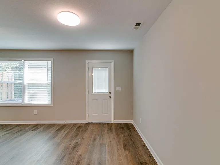 Greatroom with LVP Flooring 
Door to back Patio