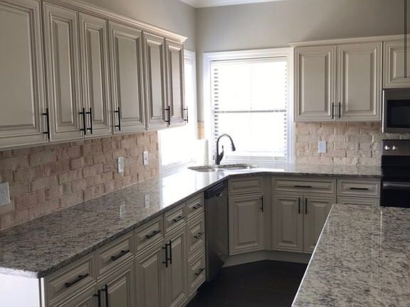 Corner sink, cream cabinets