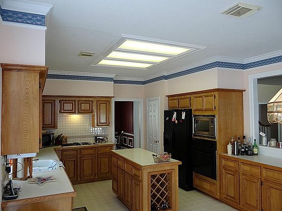 Kitchen with tiled counter-top island
