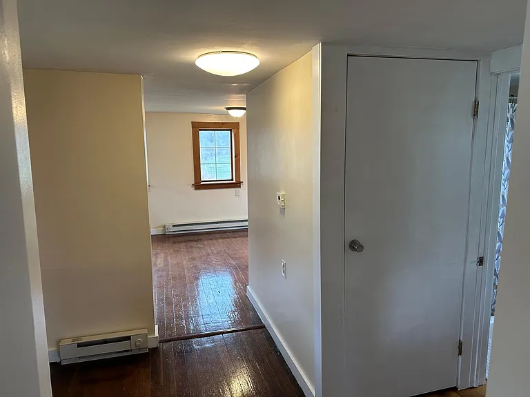 hallway connecting kitchen to office/bath/laundry/living room