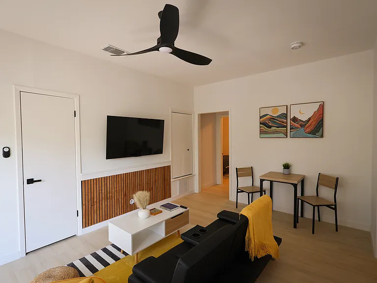 Bright and cheery living room with wifi-connected, smart TV.