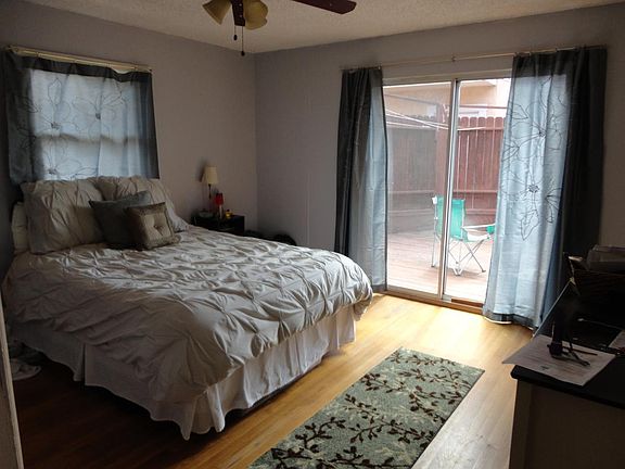 Bedroom with a glass door to the backyard