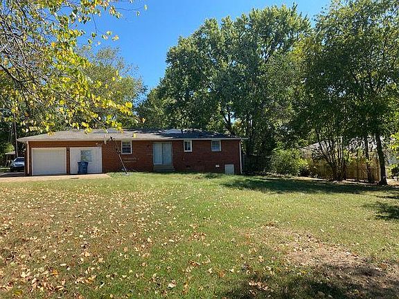 View of the back of house shows large yard