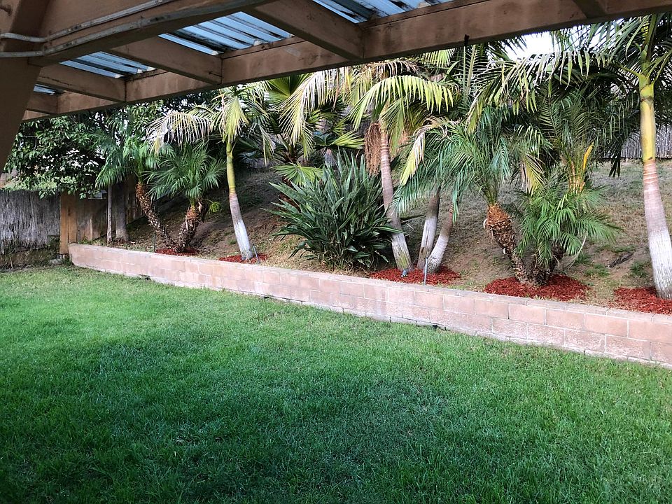 Fenced in landscaped backyard