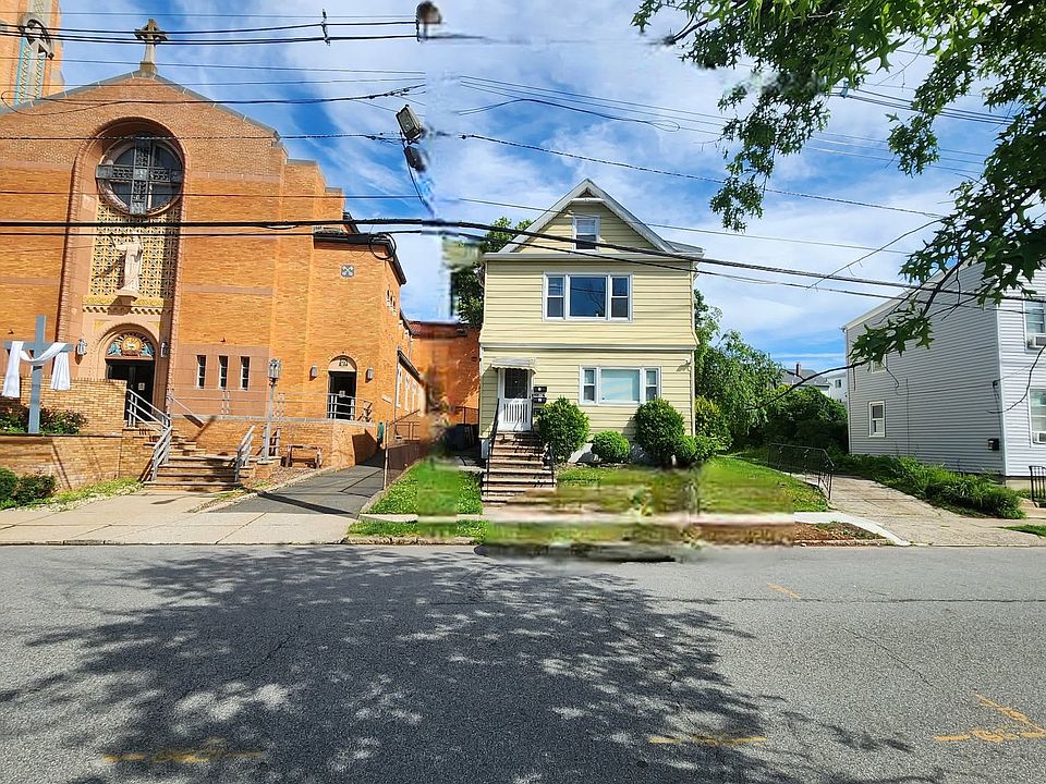 Front of the Multi family home, next to St. Valentine Church