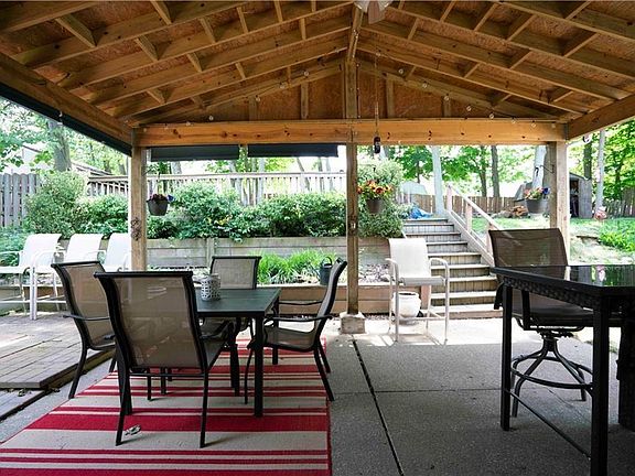 Covered patio - steps lead to elevated deck and lawn area