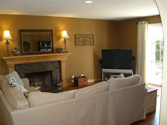family room with fireplace, patio doors