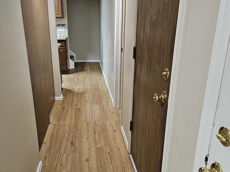 Front door down main hallway (garage door-right, utility closet-left, 1/2 bath 2nd door-right)