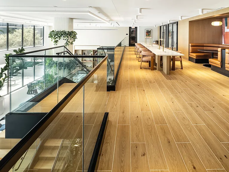 Upper-level resident lounge with co-workspaces