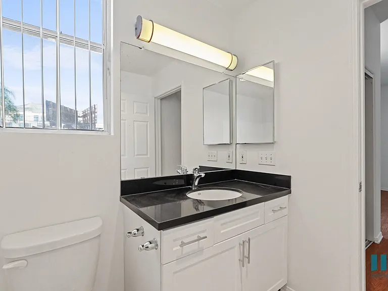 Bathroom with Vanity Cabinet Storage and Window