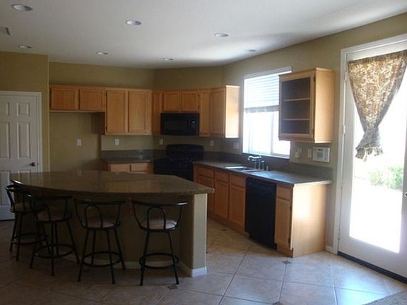 Open floor plan with granite countertops and tons of storage in kitchen with separate pantry