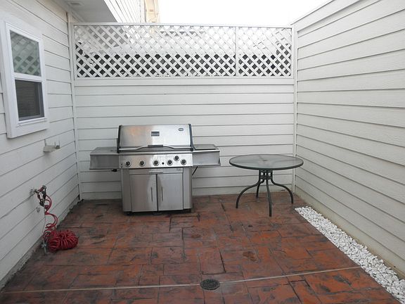 Newly tiled, spacious private patio. Plenty of room for a pet, or to entertain