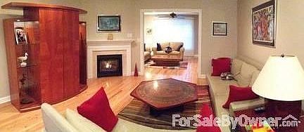Family Room (Foreground) & Living Room
						:
						Gas Fireplace with Electronic Ignition and Hardwood Floors