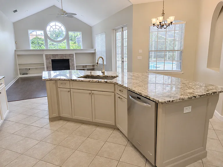 Open Kitchen Overlooking Family Room and Pool