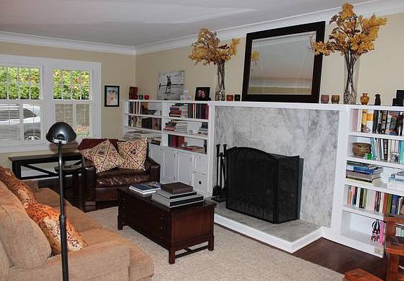 Living Room with wood burning fireplace and gas starter
