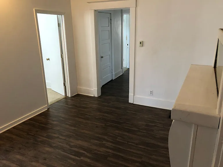 Living room. / bedroom #4 to the left. And hallway to den